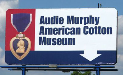 Billboard facing Interstate 30 indicating location of the Audie Murphy/American Cotton Museum.